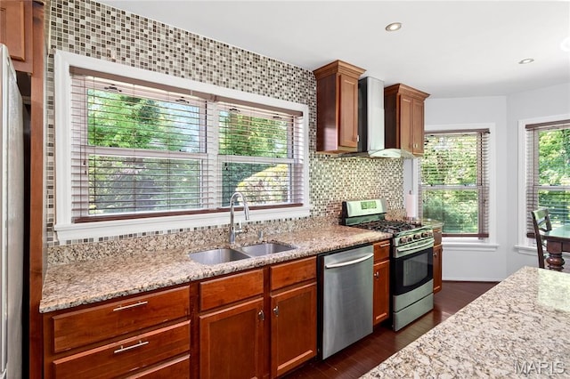 351 N 66th St, Belleville, IL 62223 - kitchen featuring stainless steel appliances, wall chimney exhaust hood, dark wood-type flooring, light stone countertops, and recessed lighting