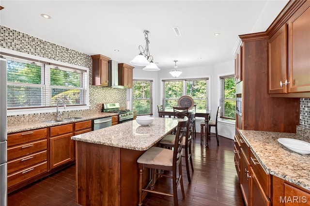 351 N 66th St, Belleville, IL 62223 - kitchen featuring stainless steel appliances, tasteful backsplash, dark wood finished floors, light stone counters, and recessed lighting