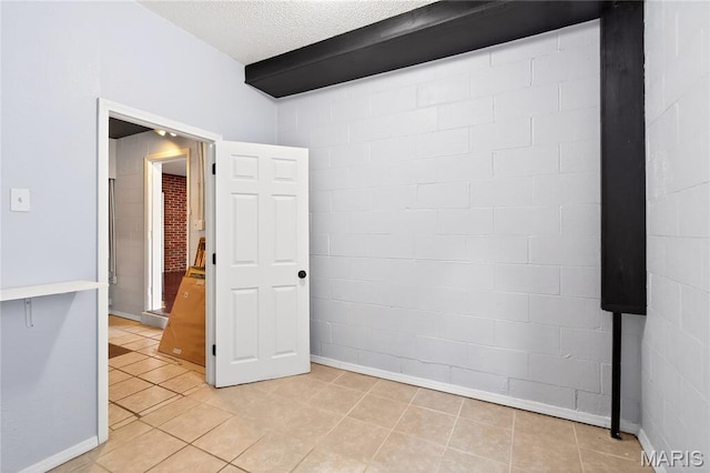 351 N 66th St, Belleville, IL 62223 - unfurnished room featuring light tile patterned flooring and a textured ceiling