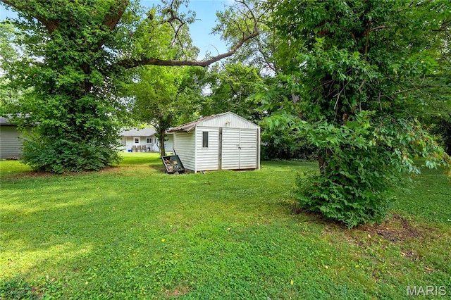 351 N 66th St, Belleville, IL 62223 - view of grassy yard with a storage shed