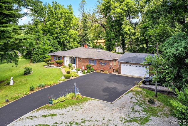 351 N 66th St, Belleville, IL 62223 - single story home with driveway, a front yard, a chimney, and brick siding