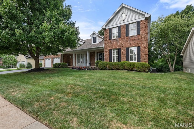 649 Westledge Ct, Des Peres, MO 63131 - view of front of home featuring brick siding, a front lawn, and a garage