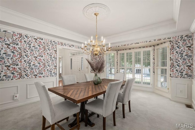 649 Westledge Ct, Des Peres, MO 63131 - dining space featuring wallpapered walls, a chandelier, a wainscoted wall, ornamental molding, and light colored carpet