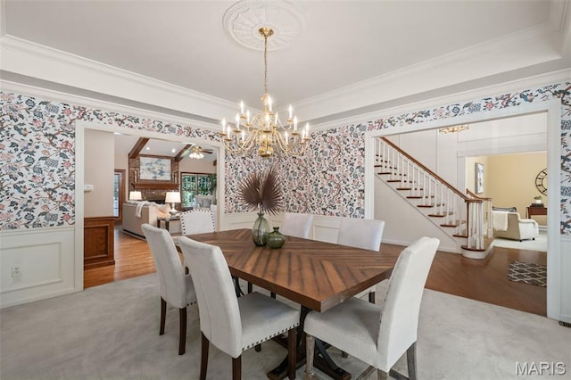 649 Westledge Ct, Des Peres, MO 63131 - dining room with wallpapered walls, a wainscoted wall, stairs, ornamental molding, and a chandelier
