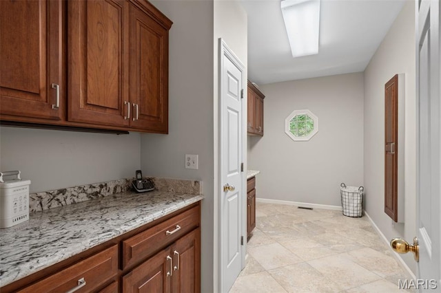 649 Westledge Ct, Des Peres, MO 63131 - laundry room with baseboards