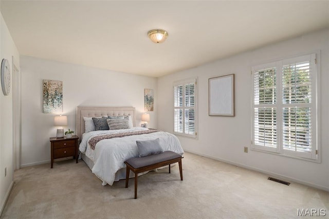 649 Westledge Ct, Des Peres, MO 63131 - bedroom with multiple windows and light carpet