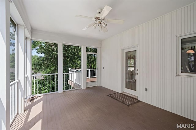 649 Westledge Ct, Des Peres, MO 63131 - unfurnished sunroom with ceiling fan and wood-type flooring
