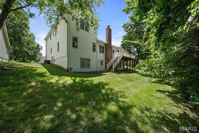 649 Westledge Ct, Des Peres, MO 63131 - rear view of house with stairs, a chimney, a deck, and a lawn