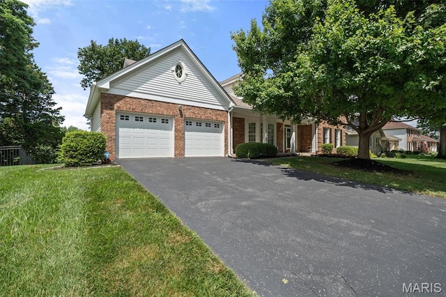 649 Westledge Ct, Des Peres, MO 63131 - ranch-style home featuring driveway, an attached garage, brick siding, and a front lawn