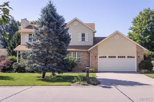 170 Coventry Way, Highland, IL 62249 - view of front of home with a garage, driveway, a front lawn, a chimney, and brick siding