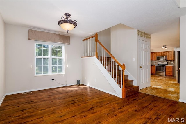 170 Coventry Way, Highland, IL 62249 - entryway with dark wood-style floors and stairs