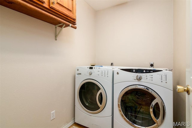 170 Coventry Way, Highland, IL 62249 - laundry area featuring cabinet space and washing machine and dryer