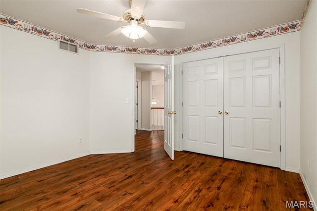 170 Coventry Way, Highland, IL 62249 - unfurnished bedroom featuring wood finished floors, a closet, and a ceiling fan