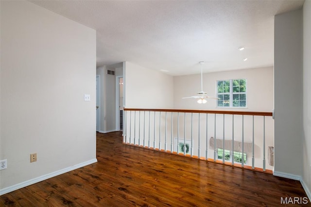 170 Coventry Way, Highland, IL 62249 - empty room with a ceiling fan and wood finished floors