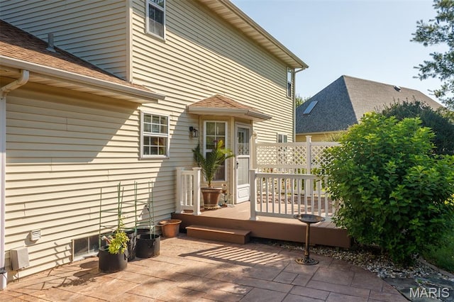 170 Coventry Way, Highland, IL 62249 - back of property featuring a patio, a wooden deck, and a shingled roof