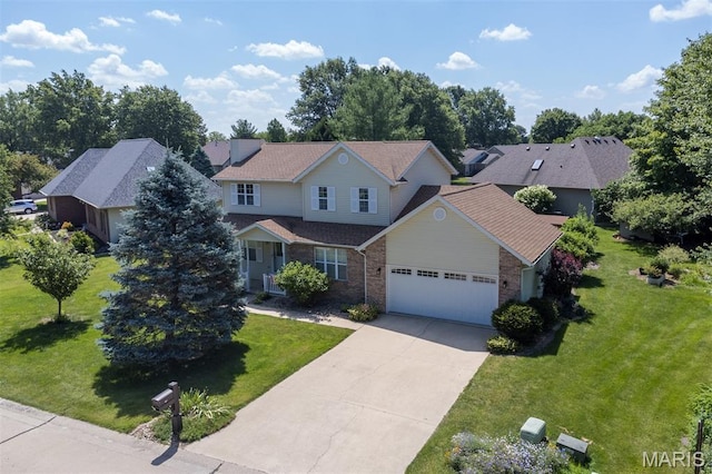 170 Coventry Way, Highland, IL 62249 - traditional-style home with brick siding, an attached garage, driveway, and a front yard