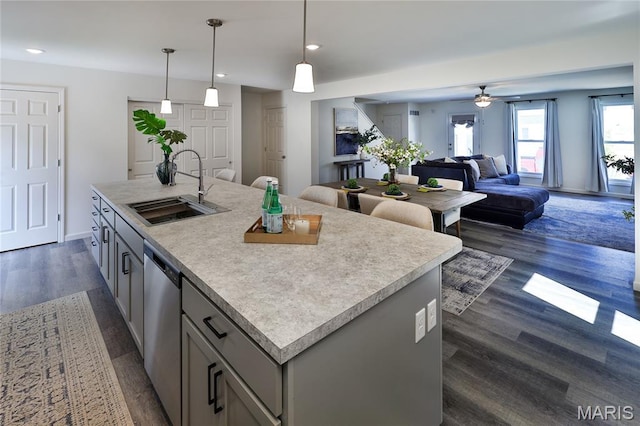 3092 Pirogue St, Saint Charles, MO 63301 - kitchen with dishwasher, gray cabinets, dark wood-type flooring, a ceiling fan, and open floor plan