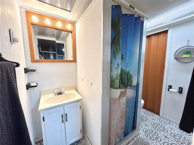 56319 Meyer Trl, Hannibal, MO 63401 - full bath with vanity, a shower, and tile walls