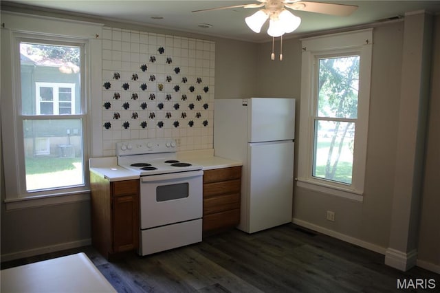 408 W Locust St, Paris, MO 65275 - kitchen with white appliances, brown cabinetry, ceiling fan, tasteful backsplash, and plenty of natural light