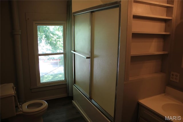 408 W Locust St, Paris, MO 65275 - full bath featuring vanity, shower / bath combination with glass door, and wood finished floors