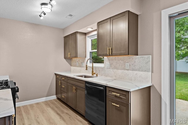 525 Homestead Ave, Swansea, IL 62226 - kitchen featuring dishwashing machine, tasteful backsplash, light wood-style flooring, light stone counters, and stainless steel range with gas stovetop
