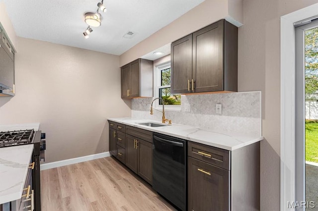525 Homestead Ave, Swansea, IL 62226 - kitchen with dishwasher, decorative backsplash, light stone countertops, range with gas cooktop, and light wood-style flooring