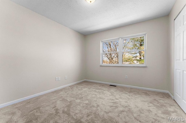 525 Homestead Ave, Swansea, IL 62226 - carpeted spare room with baseboards and a textured ceiling