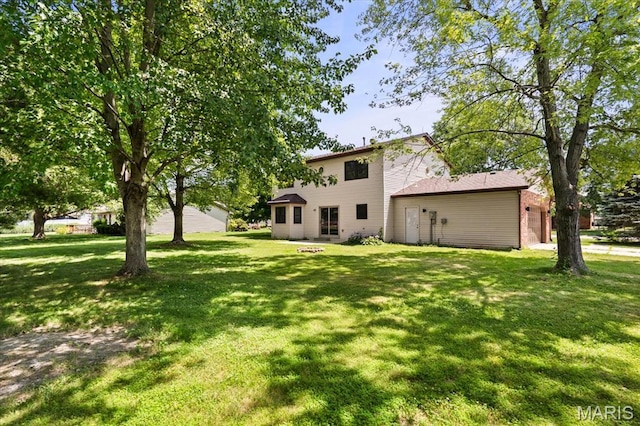 525 Homestead Ave, Swansea, IL 62226 - view of green lawn with a garage