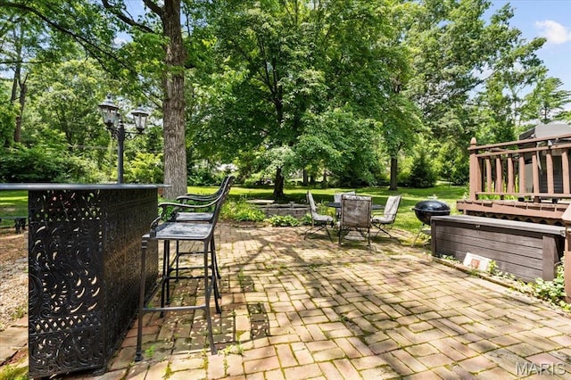 1843 Manor Hill Rd, Saint Louis, MO 63131 - view of patio with outdoor dining space and view of scattered trees