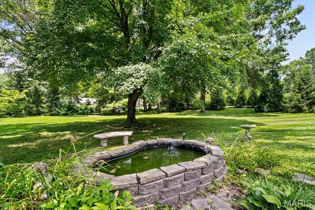 1843 Manor Hill Rd, Saint Louis, MO 63131 - view of grassy yard with a small pond