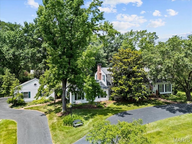 1843 Manor Hill Rd, Saint Louis, MO 63131 - view of front of house with a front yard and a chimney