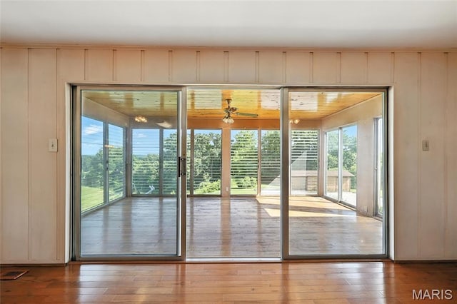 1467 Crystal Heights Rd, Crystal City, MO 63019 - doorway to outside with healthy amount of natural light, hardwood / wood-style floors, a ceiling fan, and a decorative wall