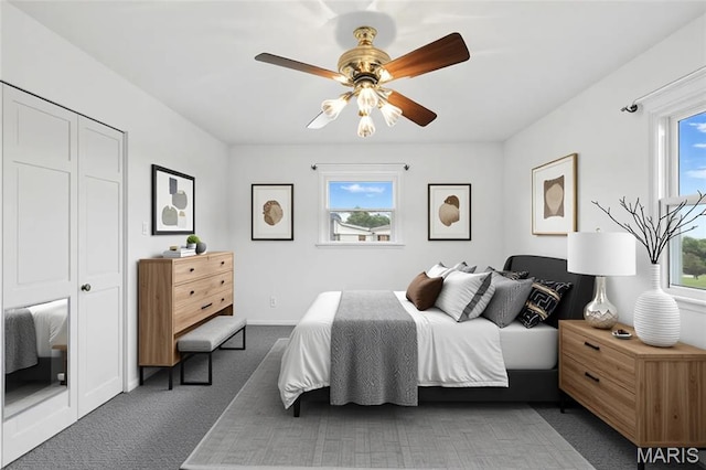 1467 Crystal Heights Rd, Crystal City, MO 63019 - bedroom with multiple windows, dark carpet, and a ceiling fan