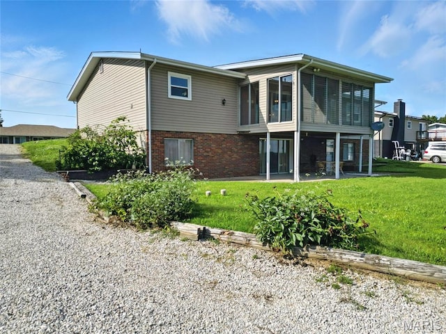 1467 Crystal Heights Rd, Crystal City, MO 63019 - rear view of house with a sunroom, brick siding, a yard, and a patio