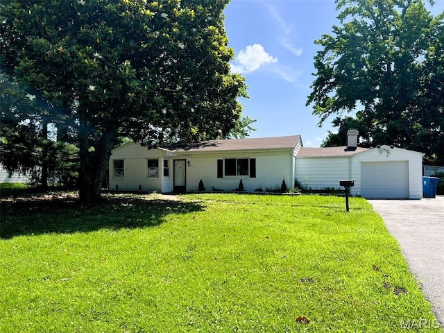 544 Hentschel Pl, Ferguson, MO 63135 - ranch-style home with asphalt driveway, a front yard, and a garage