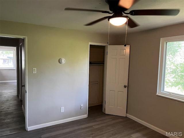 544 Hentschel Pl, Ferguson, MO 63135 - unfurnished bedroom with multiple windows, wood finished floors, and a closet