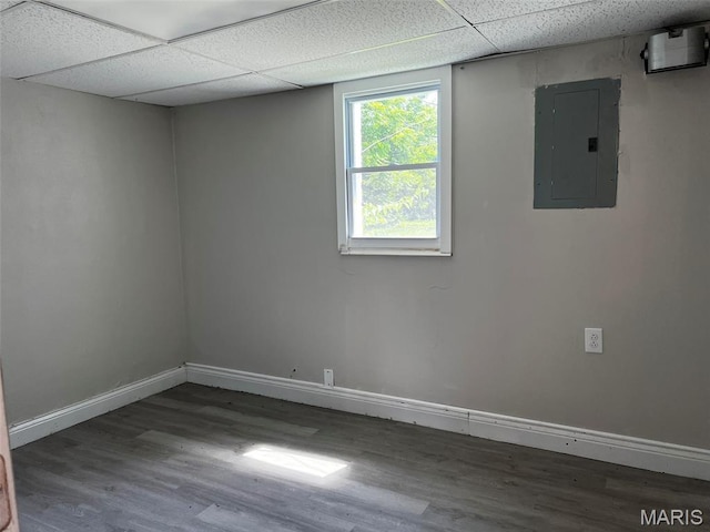 544 Hentschel Pl, Ferguson, MO 63135 - spare room featuring electric panel, wood finished floors, and a paneled ceiling