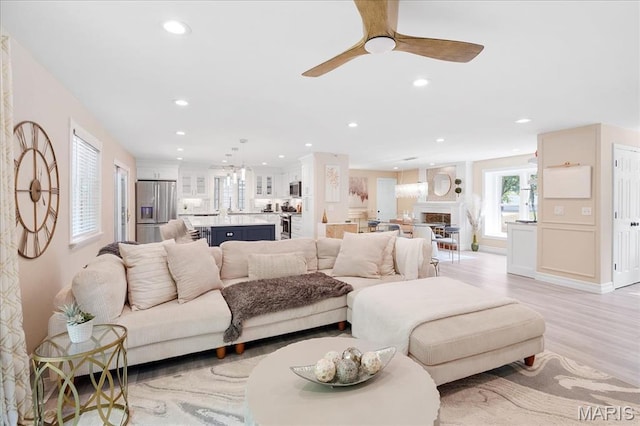 447 Maymont Dr, Ballwin, MO 63011 - living room with recessed lighting, light wood-style floors, and a ceiling fan