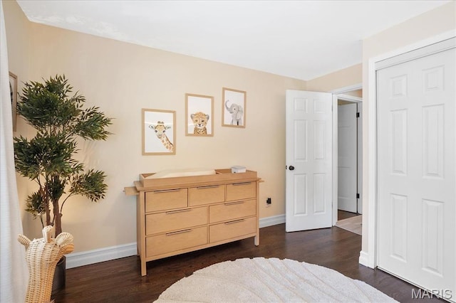 447 Maymont Dr, Ballwin, MO 63011 - bedroom featuring baseboards and dark wood-style flooring