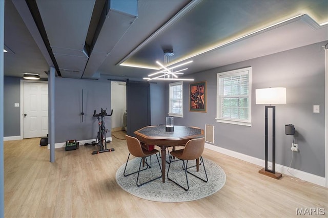 447 Maymont Dr, Ballwin, MO 63011 - dining room with a barn door and wood finished floors