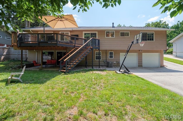 447 Maymont Dr, Ballwin, MO 63011 - back of house featuring a garage, a deck, driveway, and stairway