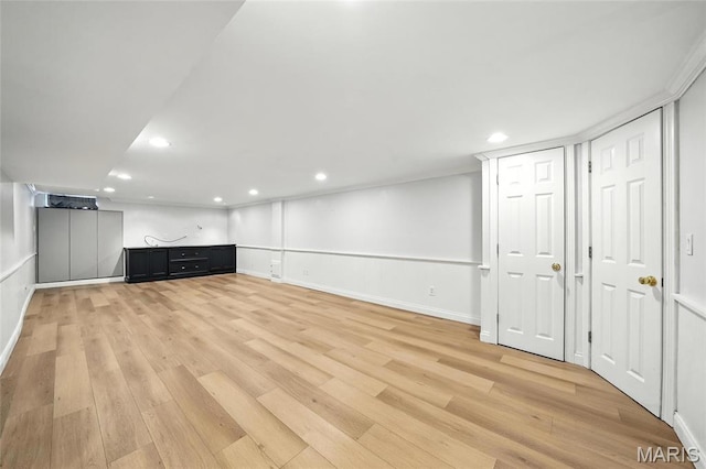 906 N Taylor Ave, Saint Louis, MO 63122 - unfurnished living room with light wood-style floors and recessed lighting
