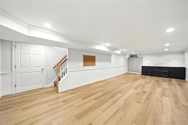 906 N Taylor Ave, Saint Louis, MO 63122 - finished below grade area featuring light wood-style floors, recessed lighting, stairs, and ornamental molding