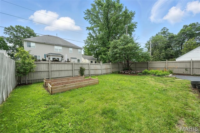 906 N Taylor Ave, Saint Louis, MO 63122 - fenced backyard with a vegetable garden