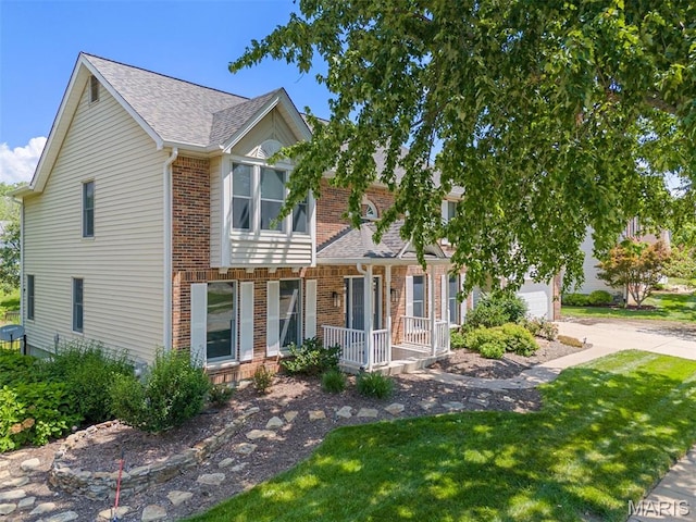 15747 Cedarmill Dr, Chesterfield, MO 63017 - view of property featuring a porch, brick siding, a front yard, roof with shingles, and a garage