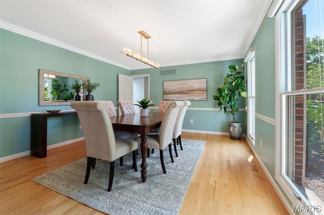 15747 Cedarmill Dr, Chesterfield, MO 63017 - dining room with wood finished floors and ornamental molding