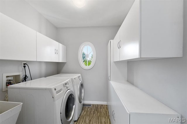 15747 Cedarmill Dr, Chesterfield, MO 63017 - laundry area featuring cabinet space and washing machine and dryer