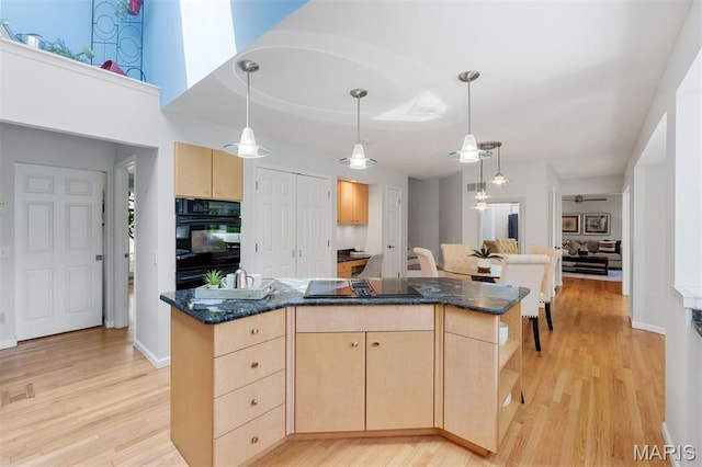 15747 Cedarmill Dr, Chesterfield, MO 63017 - kitchen with light brown cabinets, black appliances, light wood-type flooring, and a center island