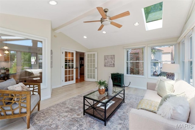 15747 Cedarmill Dr, Chesterfield, MO 63017 - living room featuring wood finished floors, ceiling fan, a skylight, recessed lighting, and french doors