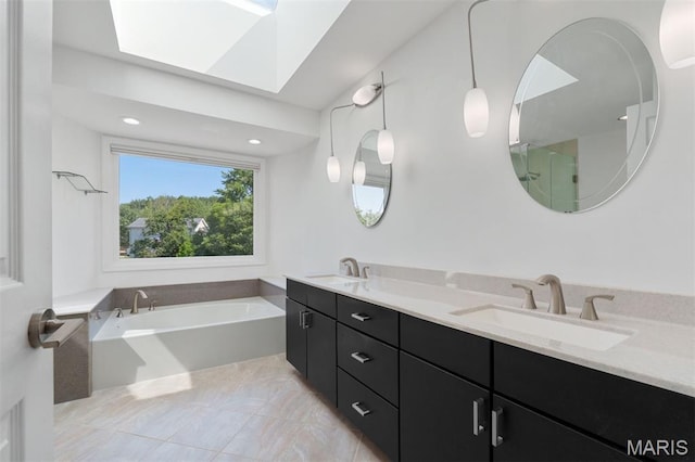 15747 Cedarmill Dr, Chesterfield, MO 63017 - bathroom featuring a garden tub, a skylight, double vanity, a shower, and recessed lighting